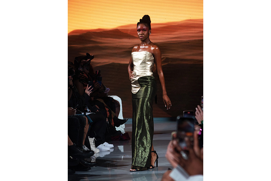 Chantelle Blake is pictured in a dark green skirt, with a silver top for the Kyle Gervacy runway, Sunday, Nov. 13