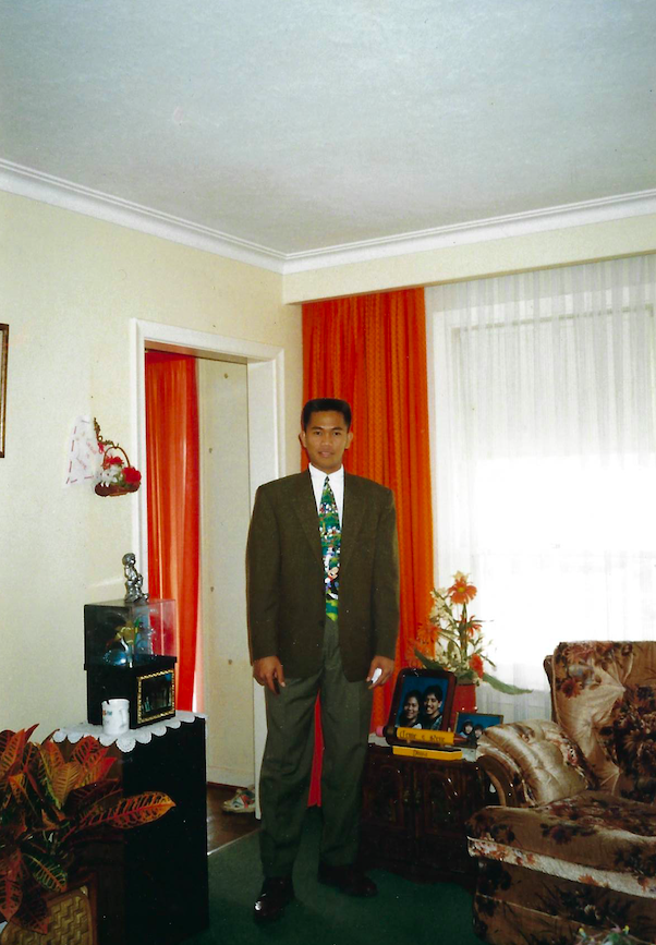 A photo of a man standing in a room