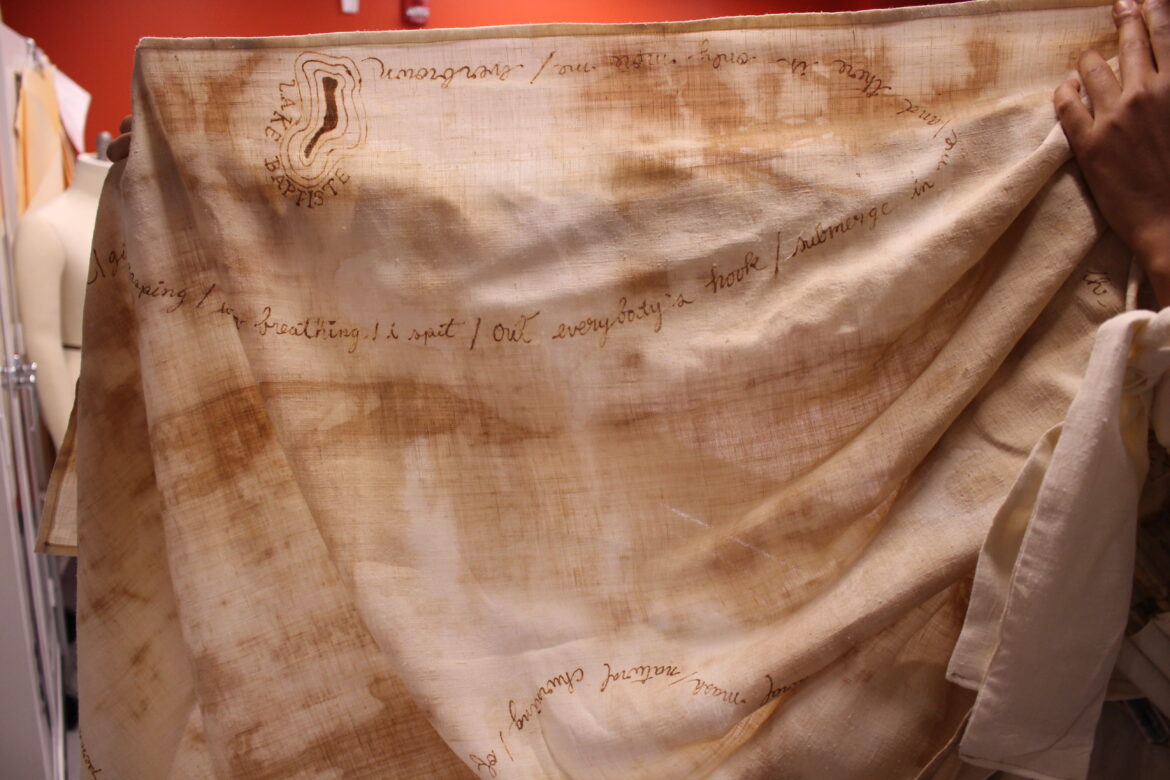 Paisley Skin scarf is shown with henna writing of Cass Myers poetry.