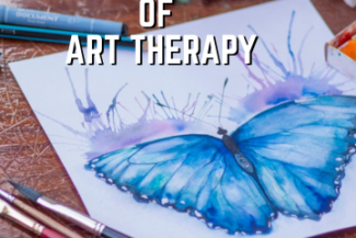 A painting of a blue butterfly on paper, on a desk with art supplies. The text reads "The Power of Art Therapy"